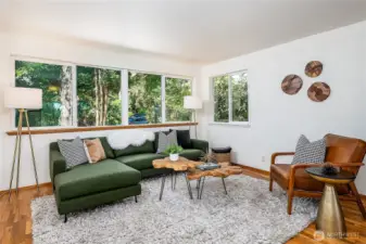 Main floor living room w/wall of windows