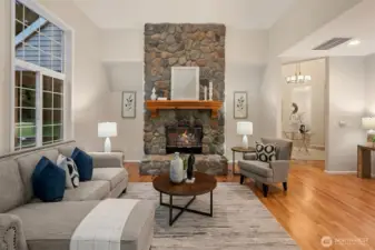 Impressive 12' river rock gas fire place in family room