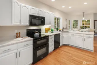 Tons of storage in this refreshed kitchen with quartz countertops and walk in pantry.