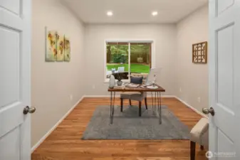 French doors open to dedicated work from home space off of entry.  Room features 2- 20 amp circuits for everything you need to plug in!