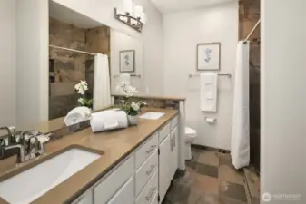 This bathroom features a walk in tile shower.