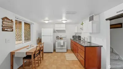 This lower level space is complete with a secondary kitchen ideal for guests, multi-generational living, or rental potential.