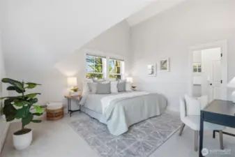 You can’t stop now, you have made it to the top floor - dedicated to an expansive primary suite with vaulted ceilings, a spa-like ensuite, walk-in closet, and private balcony—an inviting haven with views toward Magnolia.