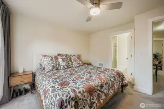 Primary bath boasts marble appointments and a dual shower.