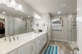 Primary ensuite bathroom with dual sinks and great storage