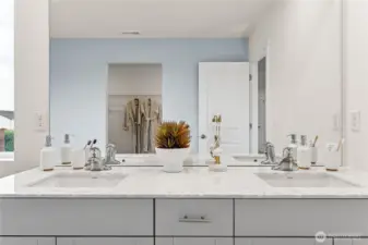 Primary bathroom features double vanity and step in shower. Photo is representational. Actual home is under construction and colors, materials, and finishes may vary. See site agent for details.