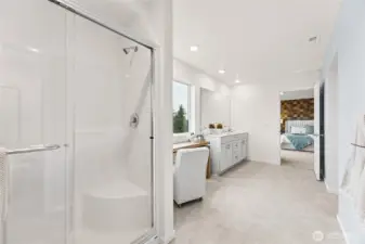 Primary bathroom features double vanity and step in shower. Photo is representational. Actual home is under construction and colors, materials, and finishes may vary. See site agent for details.