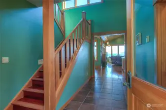 Main house entry with tile, carpet and brazilian cherry floors.