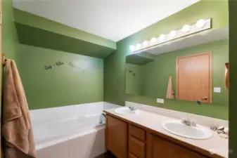 The Primary bathroom offers dual sinks & a deep soaking tub for those amazing bubble baths!