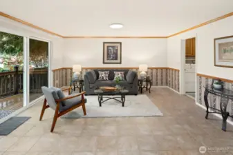 Additional living space on main floor with new sliding door leading to large and private back deck.