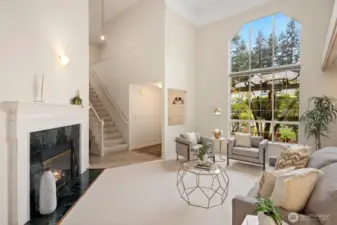 Front entry with large picture window, vaulted ceilings and gas fireplace.