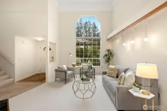 Main floor with circular floor plan and vaulted ceilings.