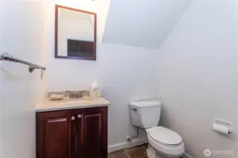 Spacious half bathroom on lower level for use by office, bonus room or any daytime guests.