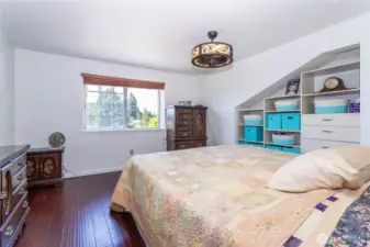 To the upstairs and on the right, is the primary bedroom, overlooking the street. Primary bath is to the left.