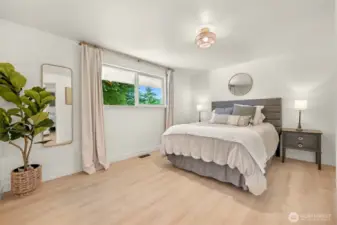 Primary bedroom with view of back yard