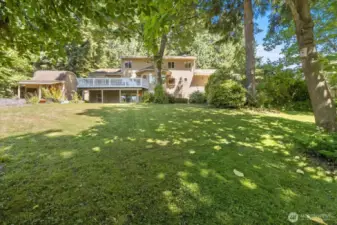 Nestled on a rare 1.3 acres, this impressive home offers space, privacy, and incredible potential. The main residence is generously sized, with classic lines and solid construction, perfect for multi-generational living or future customization. The walk out basement offers the ideal setup for a potential ADU—guest quarters, rental income, or a private home office. Surrounded by open land, mature trees, and natural beauty, this property combines the freedom of rural living with the comfort of a substantial home. A truly unique opportunity to create your dream estate.