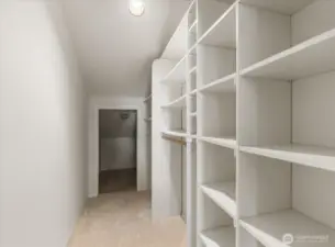 The second bedroom’s closet is equipped with built-in shelving, offering organized and efficient storage for clothing, shoes, and accessories.