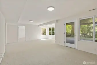 The lower-level rec room offers level access to the backyard, creating a seamless indoor-outdoor flow. Just a few steps away is a private parking area, making this space ideal for a potential ADU or versatile living area.