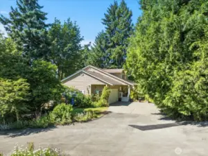 Set in a private, beautifully treed setting, this property offers peace, seclusion, and a strong connection to nature.