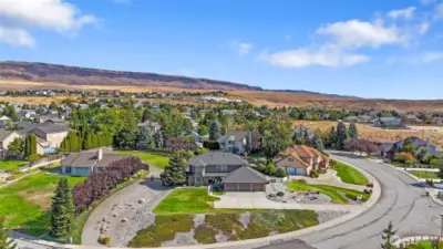 Enjoy the larger lot sizes on Grad Ave - everyone has just a bit more space
