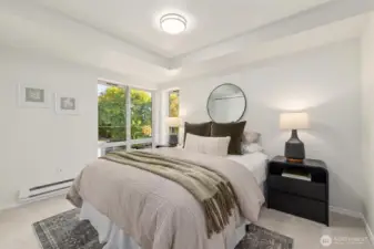 Light and bright, private bedroom accommodates a queen bed or larger