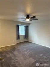 upstairs primary with walk in closet