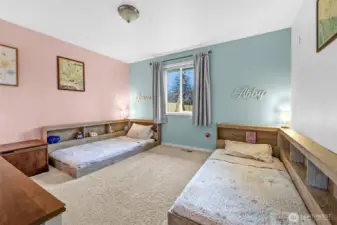 Guest room 3 with accent wall, spacious closet, and views of the huge backyard