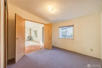 With double doors to the living room, this bedroom would also make a nice office space.