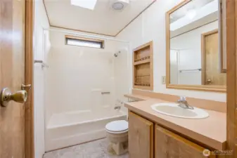 Hall bathroom has a shower and a bathtub.