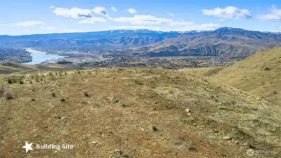 Prime building site positioned to capture sweeping mountain and river views in every direction.