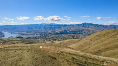 Elevated acreage offering unmatched privacy with wide-open views of Wenatchee and surrounding hillsides.
