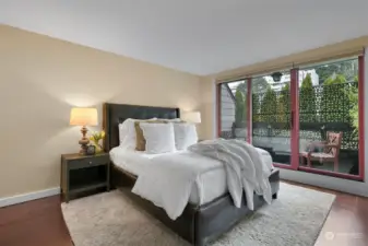 Roomy primary bedroom that has a new thermal pane door to your private patio