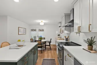 Quartz countertops and plenty of space. Check out the Kohler cast iron sink!