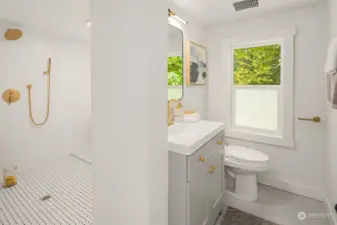 Exquisite bathroom on upper floor with shower and soaking tub