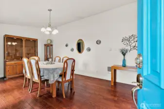 Step inside, you are greeted by the expansive dining room with engineered hardwood floors.