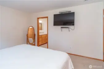 The en-suite bathroom is through the door to the left.