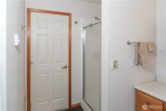 The bathroom shop features a walk-in shower.