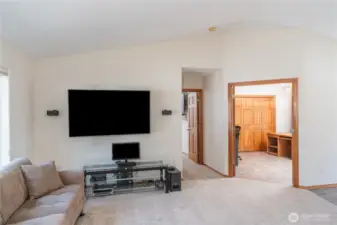 From the living room looking toward the office. Office has glass doors.