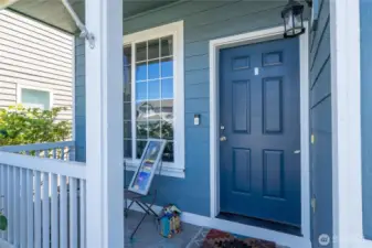 Entry detail featuring cozy seating area with blue door