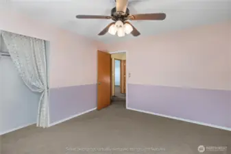 Alternate view of third bedroom with ceiling fan highlighting natural light and comfort