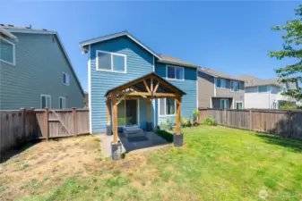 Back exterior showing siding, gazebo, and private yard space