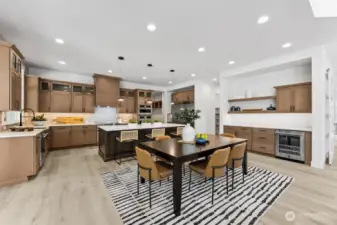 A gorgeous chef's kitchen, complete with a buffet and beverage fridge.