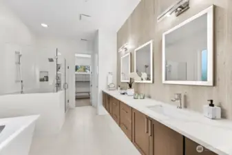 Spa bath with heated floors, extensive tile, walk in shower, and soaking tub.