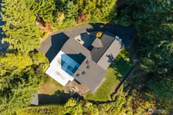 Home is surrouned by forest on a generous, but easily maintained yard