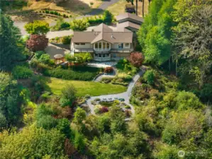 Beautiful NW contemporary home with expansive territorial views on 2.83 acres! This 3,286 sq ft home is designed for flexibility and multigenerational living.