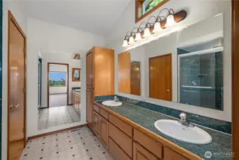 Primary bathroom and tiled walk-in shower.