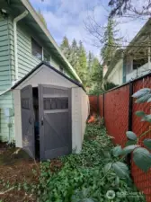 behind this shed is another shed bulging with fire wood