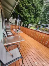 deck runs width of house and is large enough to double as covered parking