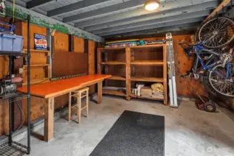 The detached garage has a workbench, bike storage and room for your car!