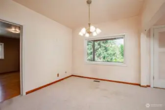 Dining room; primary bedroom is on the left